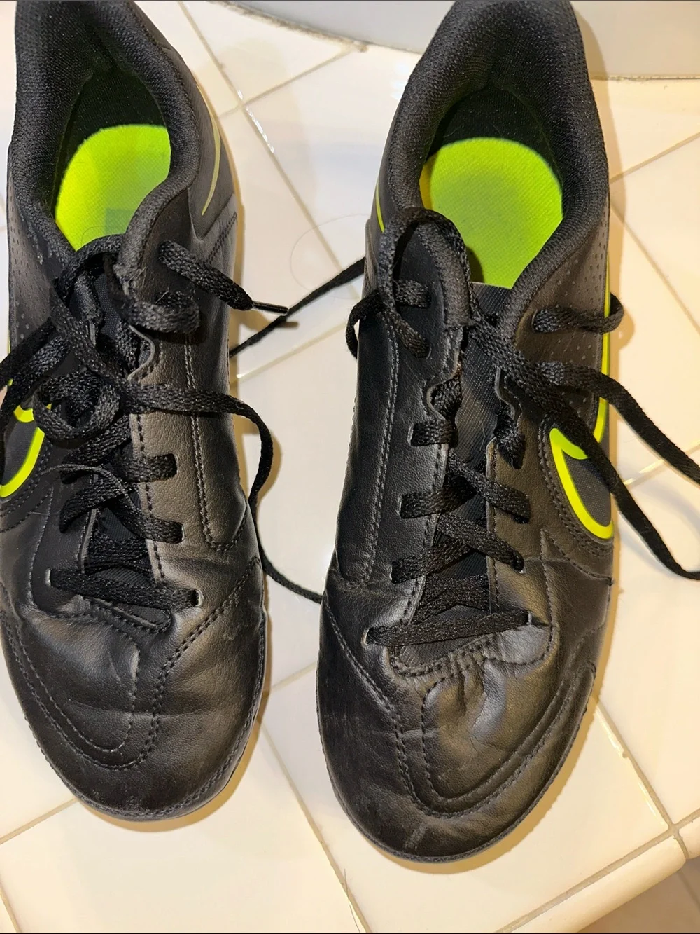Nike Black youth Athletic cleat Shoes with Volt Swoosh